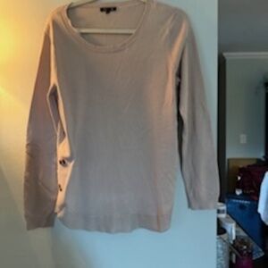 Sweater with button accents on side